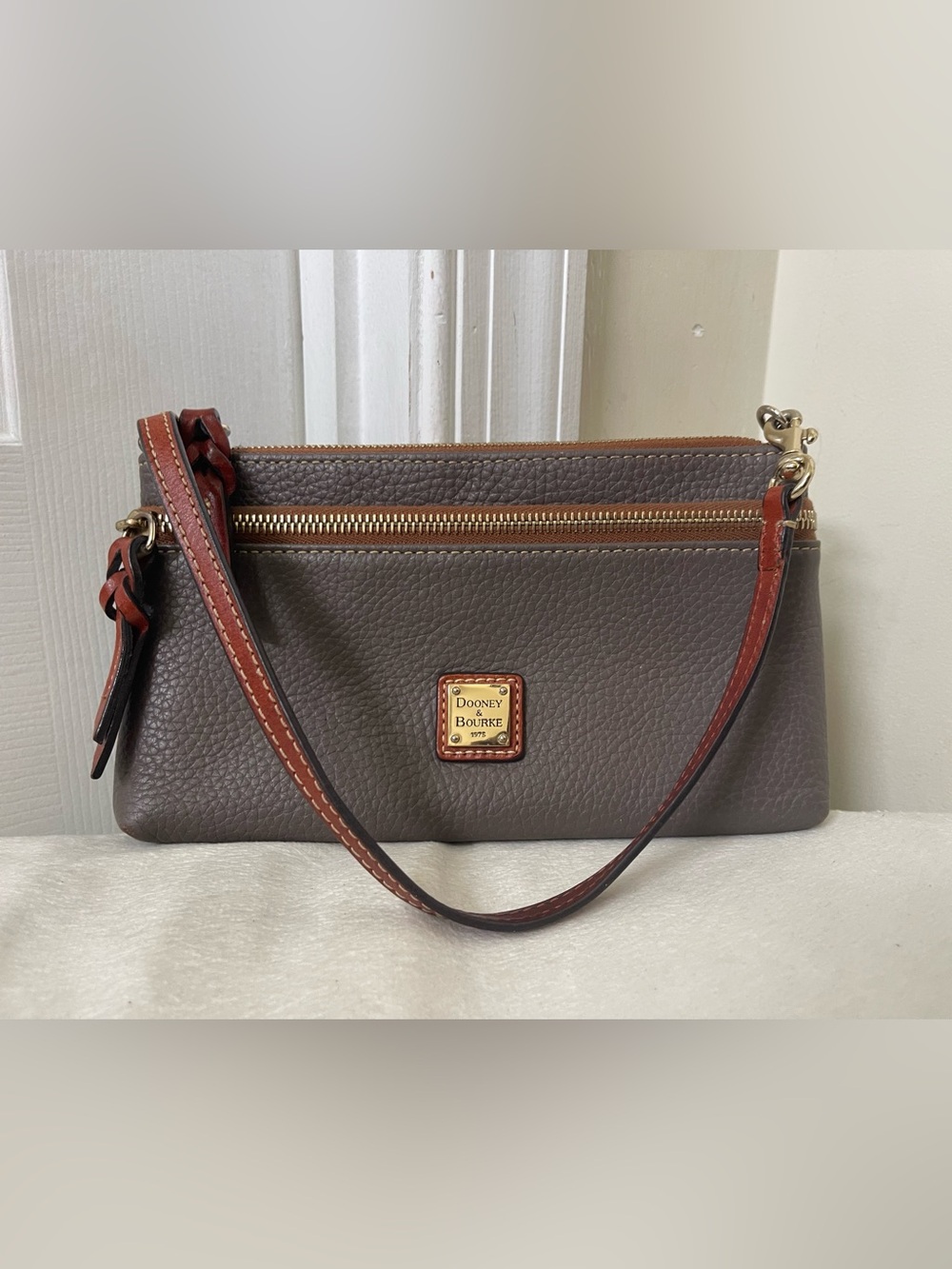 Dooney & Bourke Pebble Leather Wristlet clutch in Taupe with Brown Trim